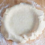 Unbaked homemade pie crust in pie pan.