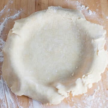 Unbaked homemade pie crust in pie pan.