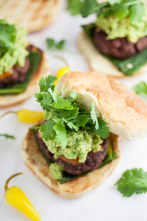 Grilled roasted poblano burgers with avocado guacamole and fresh cilantro.