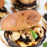 Grilled eggplant sandwiches on toasted buns with miso mayo, kimchi, and Thai basil.