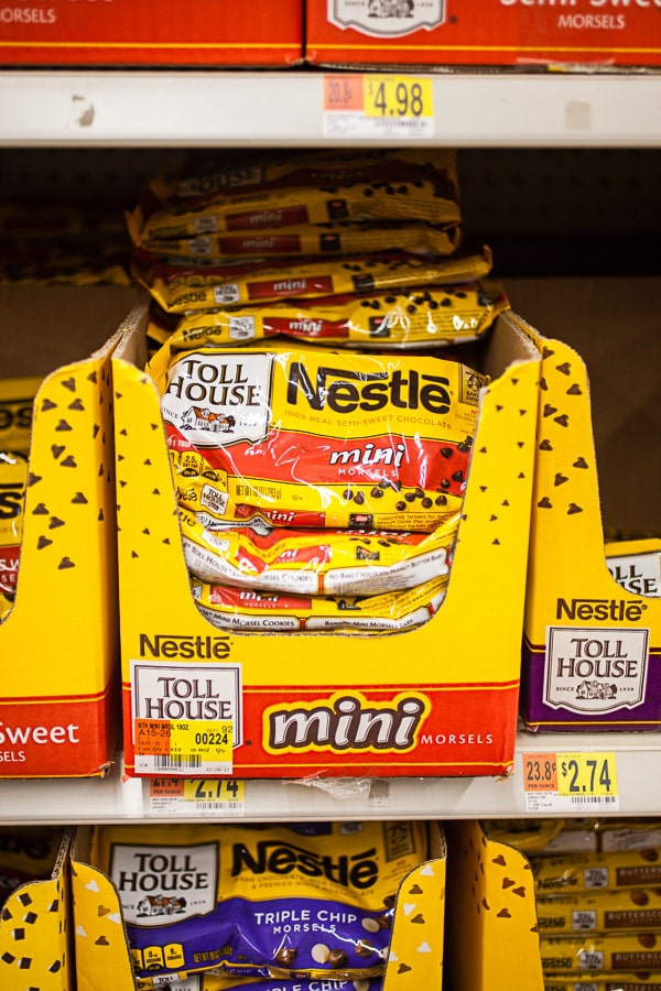 Bags of chocolate chips on store shelf.