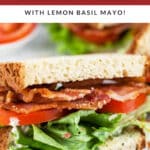 BLT sandwich with lemon basil mayo cut in half.
