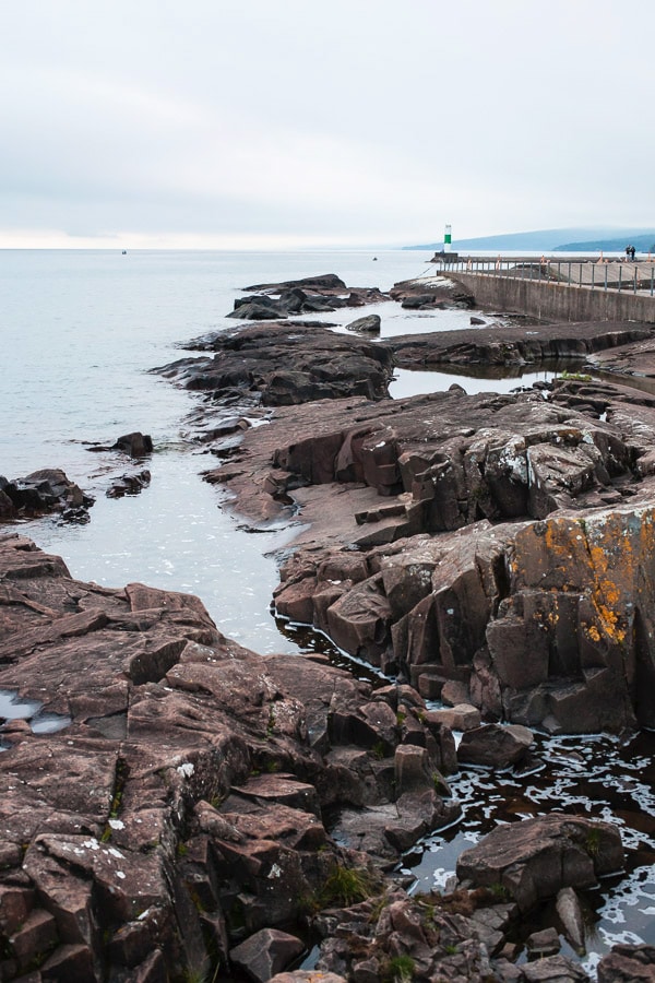 Blue water against rocky shoreline.