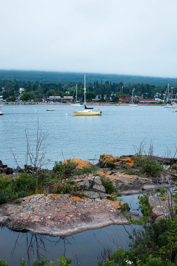 Small sailboat in harbor.