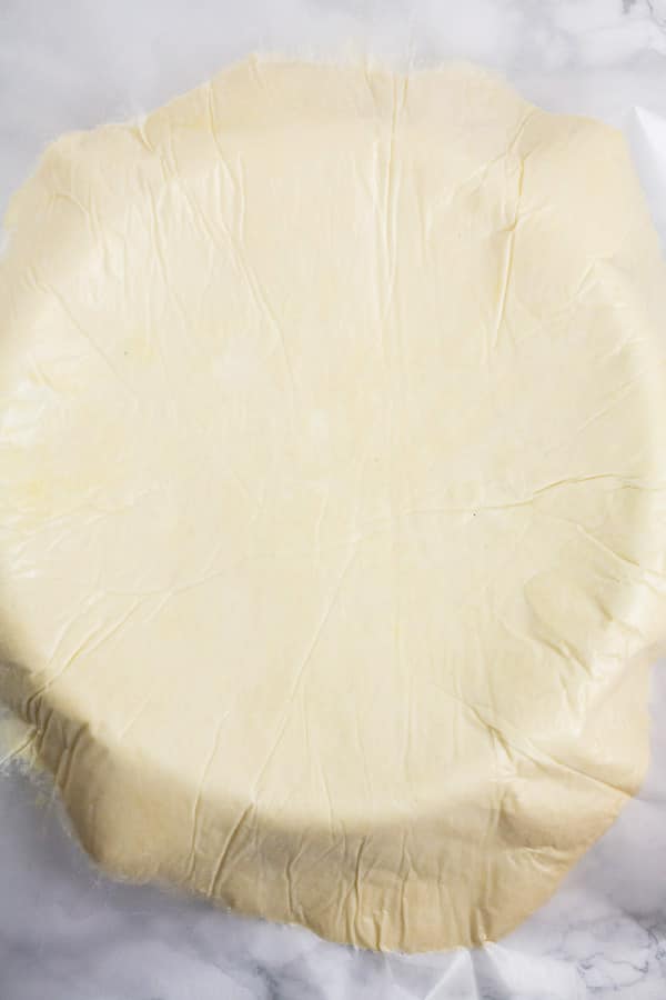 Pie dough on top of pie dish.