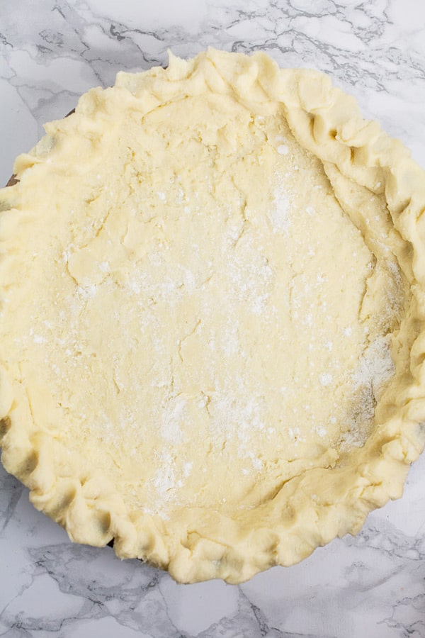 Unbaked pie dough in pie dish.
