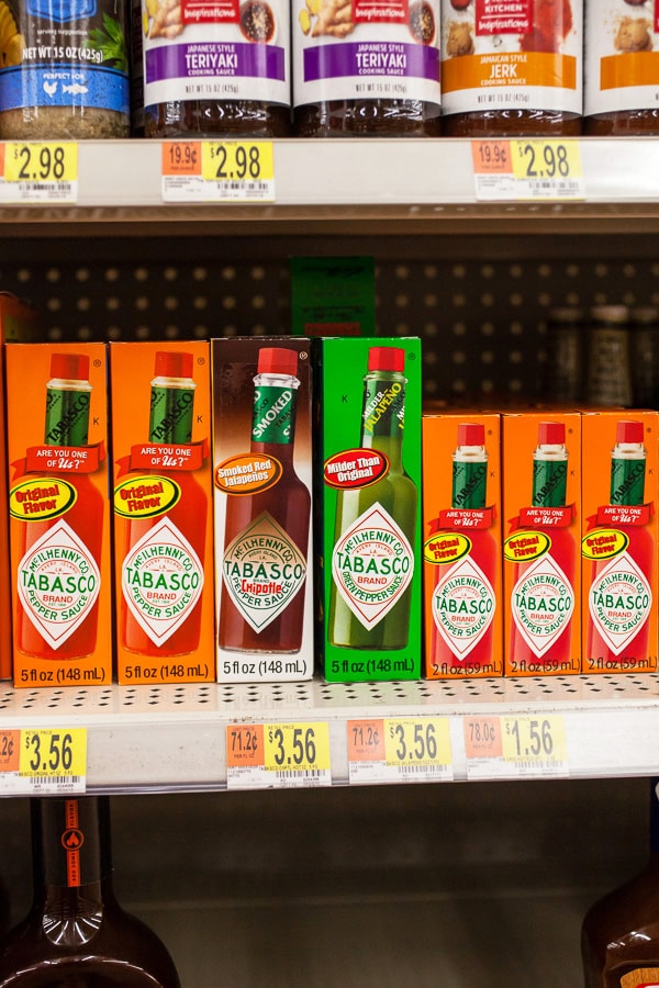 Boxes of Tabasco sauce varieties on store shelf.