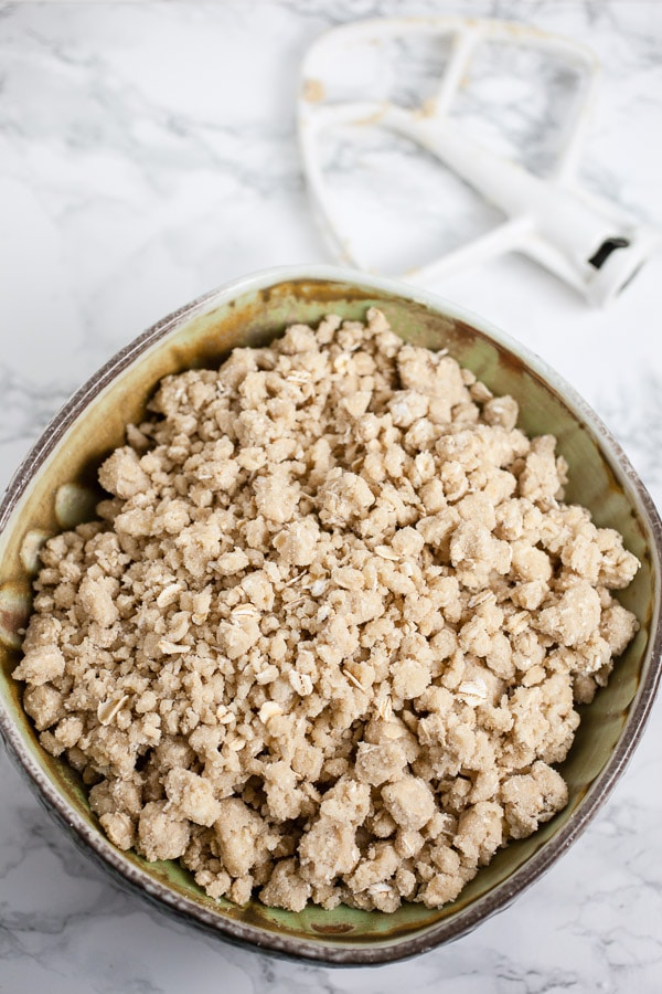 Oatmeal streusel topping in ceramic bowl.