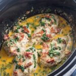 Creamy Chicken, Spinach, and Tomatoes In Black Slow Cooker
