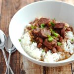 Red Beans and Rice In White Bowl On Wooden Surface