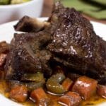 Short Ribs and Carrots On White Plate