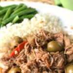 Shredded Meat, Olives, White Rice, and Green Beans On White Plate