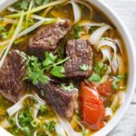 Vietnamese Beef Stew With Noodles In White Bowl