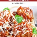 Spaghetti and turkey meatballs garnished with Parmesan cheese and fresh basil.
