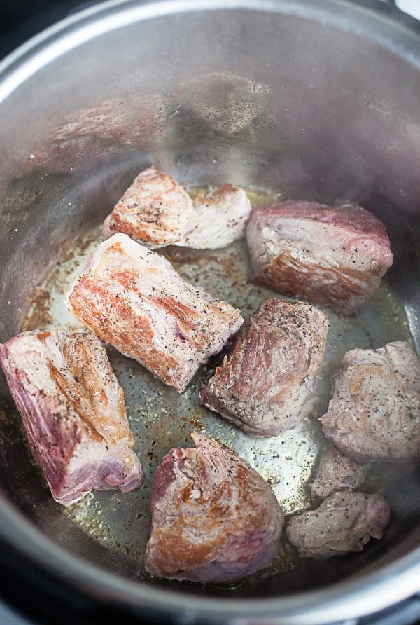 Seared chunks of pork shoulder sautéed in Instant Pot.