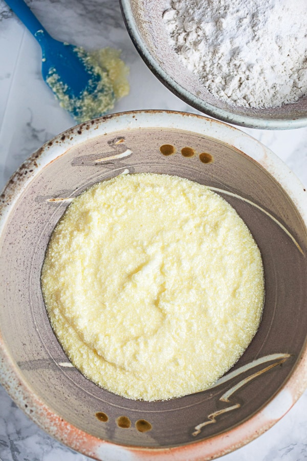 Wet and dry ingredients in two separate ceramic bowls.