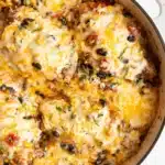 Santa Fe chicken in skillet with melted cheese.