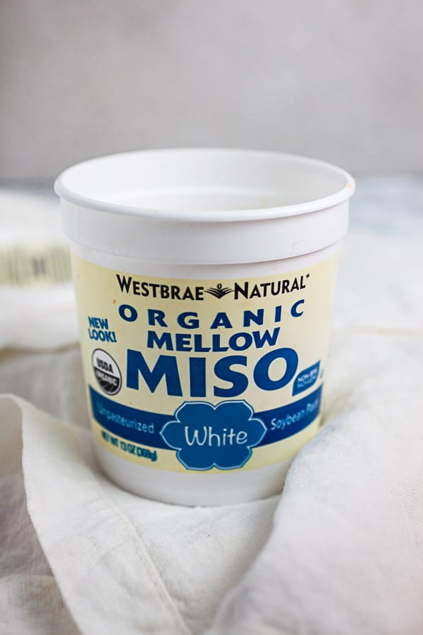 Package of organic white miso on white towel.