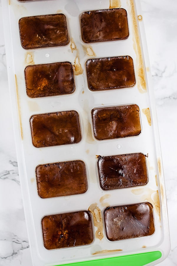 Frozen coffee ice cubes in tray.