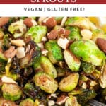 Maple mustard roasted Brussels sprouts with almonds and lemon wedge.