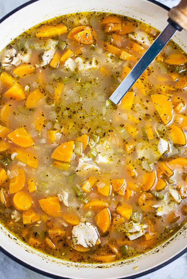 Turkey soup ingredients simmering in Dutch oven.