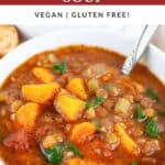Instant Pot lentil soup in white bowl with spoon.