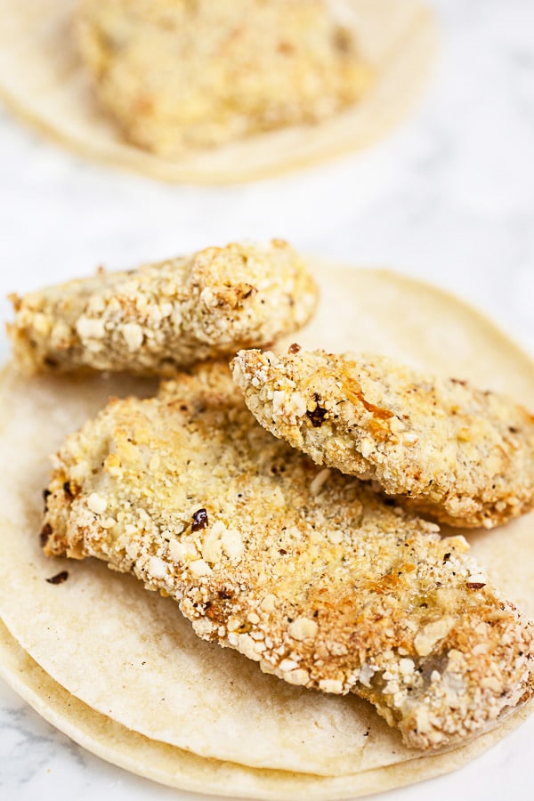 Crispy Panko breaded fish fillets on corn tortillas.