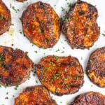 Sliced BBQ sweet potatoes on white surface.