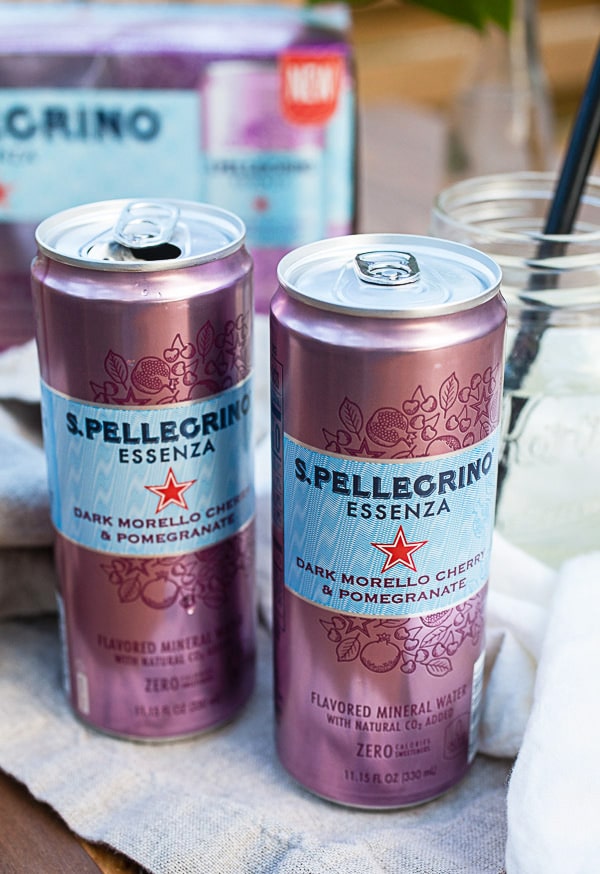 Cans of sparkling water on an outdoor table.