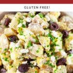 Mediterranean potato salad garnished with fresh chives in ceramic bowl.