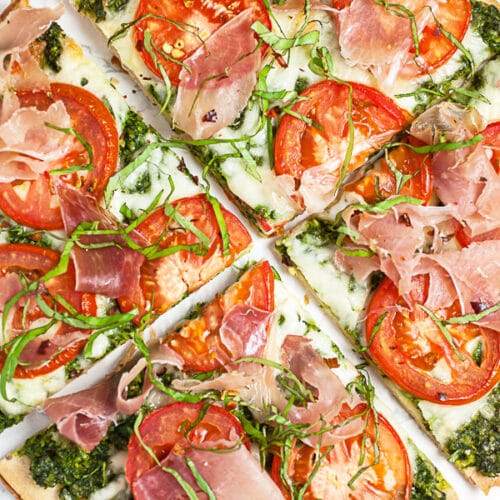 Arugula Pesto Pizza with Prosciutto and Tomato The Rustic Foodie®