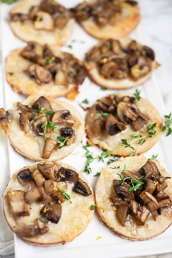 Mushroom-Gruyere-Thyme-Tartlets-On-White-Serving-Platter