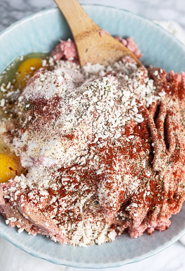 Ground turkey, eggs, breadcrumbs, and spices in mixing bowl.