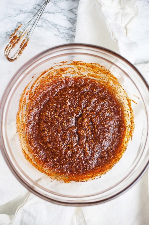 Maple syrup, smoked paprika, and butter glaze in small glass bowl.