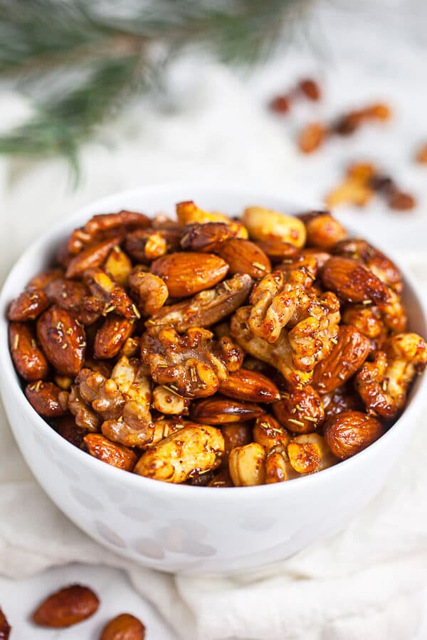 Spiced maple roasted nuts in small white bowl.
