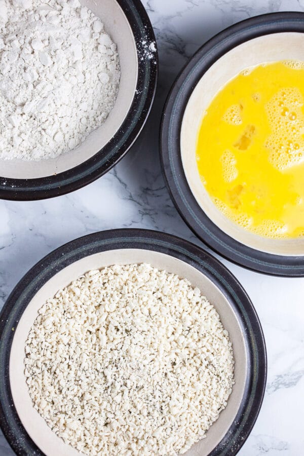 Flour, eggs, and Panko breadcrumbs in three separate bowls.