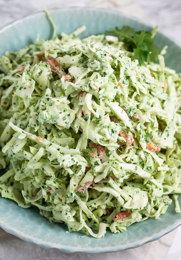 Spicy cilantro lime coleslaw in blue bowl.