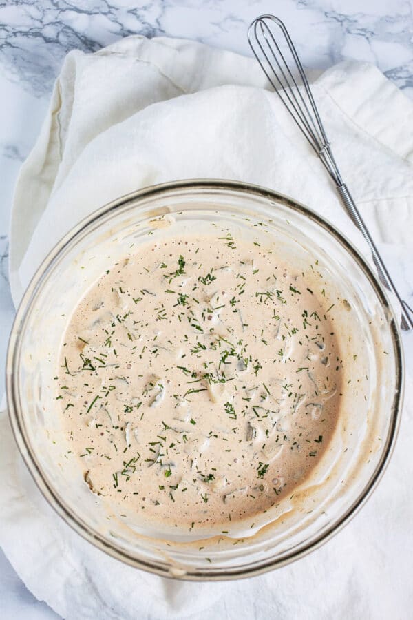 Homemade Thousand Island dressing in small glass bowl.