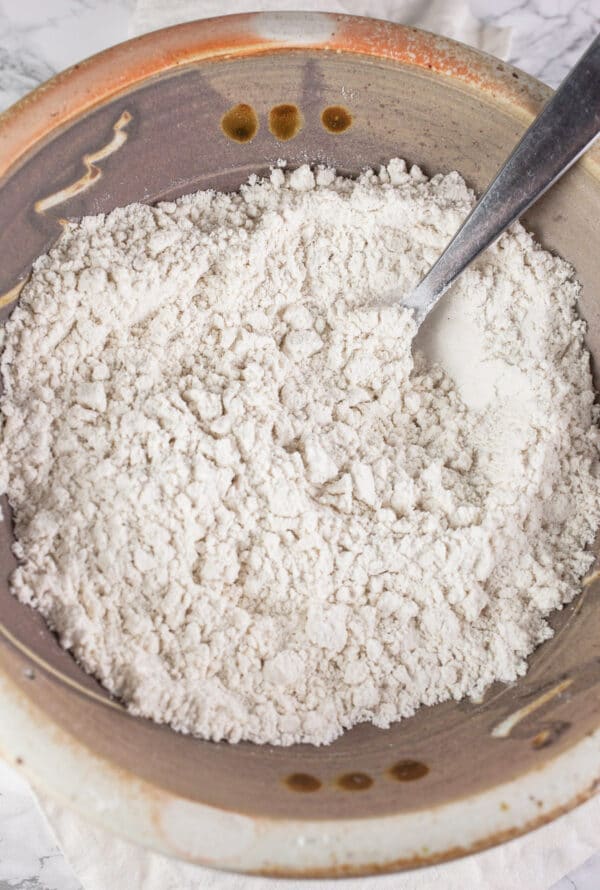 Dry ingredients combined in ceramic bowl.