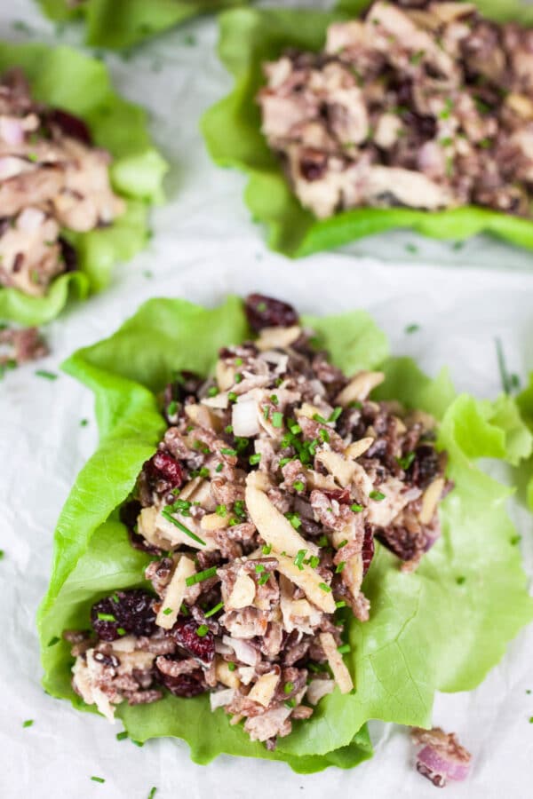 Cranberry, almond, and wild rice chicken salad in lettuce cups.