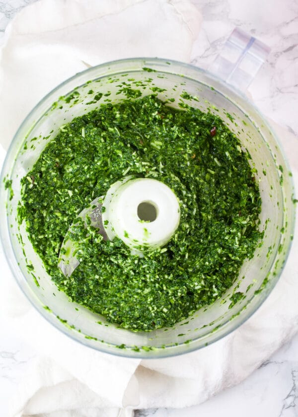 Spinach basil pasta sauce blended in food processor.