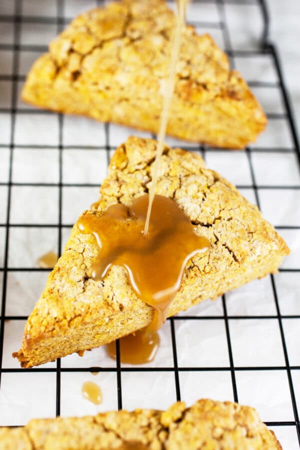 Maple glaze drizzled onto pumpkin scones.