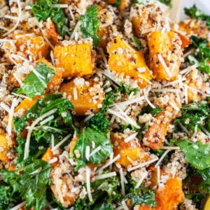 Roasted butternut squash quinoa kale salad with Parmesan cheese.