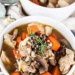 Autumn wild rice soup in small white bowls.