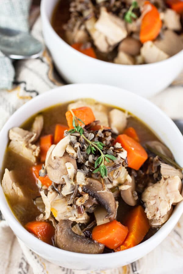 Autumn wild rice soup in small white bowls.