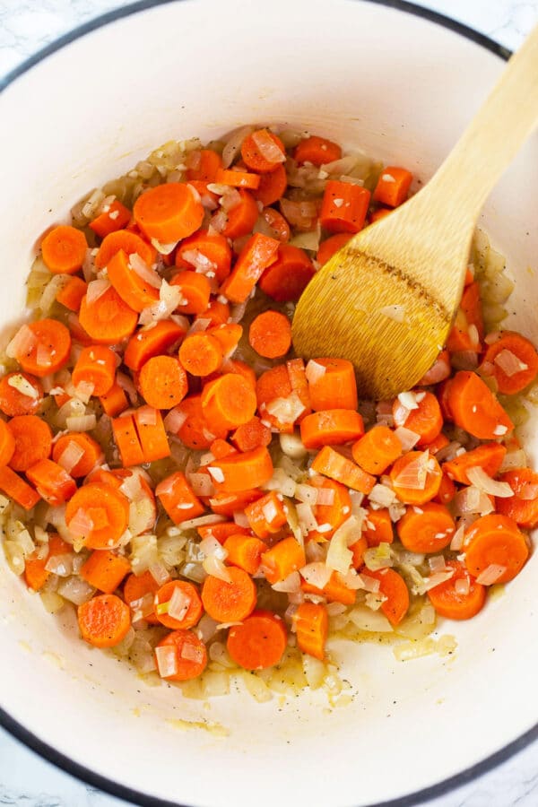 Garlic, onions, and carrots sautéed in Dutch oven.