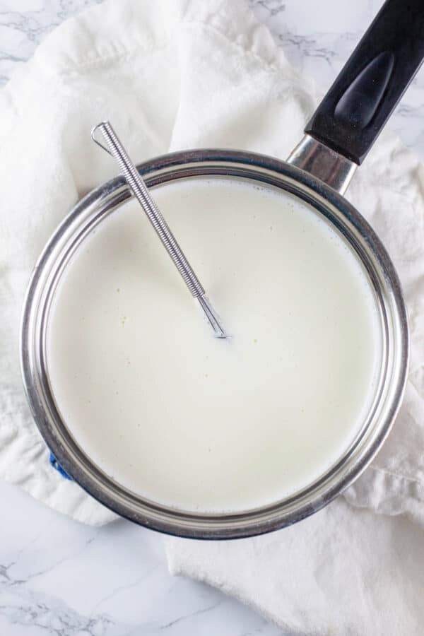 Heavy cream, sugar, gelatin, and vanilla extract cooked in small sauce pan.