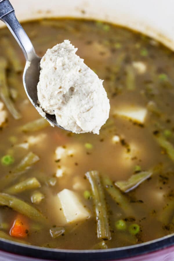Spoonful of dumpling batter added to vegetable stew.