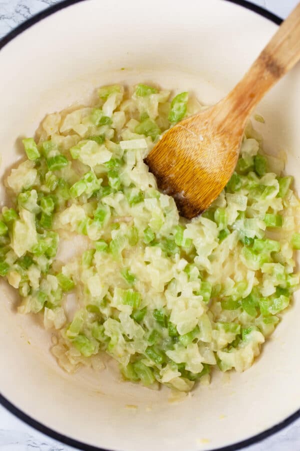 Garlic, onions, and celery sautéed with white wine in Dutch oven.