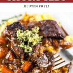 Italian short ribs with carrots and sauce on polenta topped with lemon rosemary gremolata.